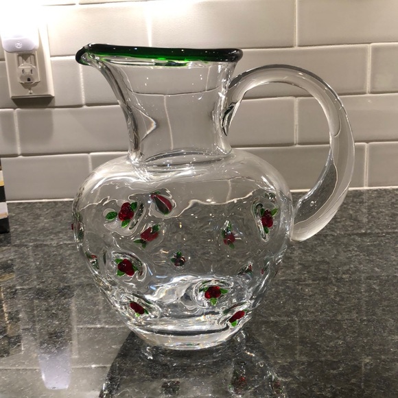 Mackenzie-Childs pitcher embossed with flowers.